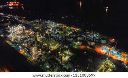 Aerial drone night shot of famous full working plant and oil refinery of Motor Oil in Corinth area, Greece