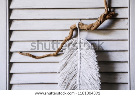 macrame, lace on the wooden background. dream catcher, shabby chic, copy space. 