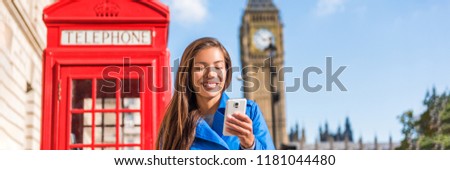 London phone woman walking on city street holding cellphone texting with british landscape, red telephone booth and Big Ben Clock Tower, London, England, UK. Banner panorama.