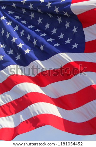 Close up isolated colorful waving rippled United states of American U.S. flag with stars and stripes red white and blue 4th of July