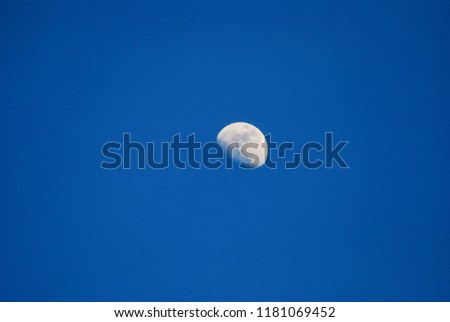 The moon against a blue sky