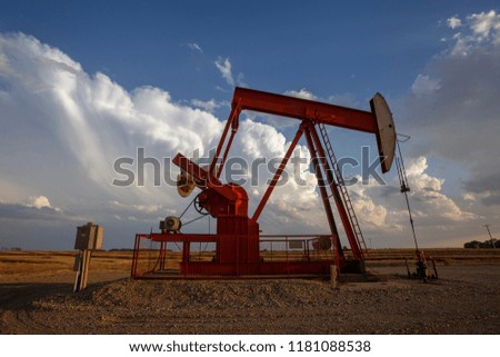 Prairie Storm Clouds Saskatchewan oil pump jack