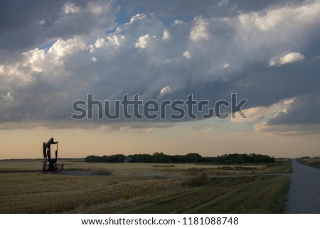 Prairie Storm Clouds Saskatchewan oil pump jack