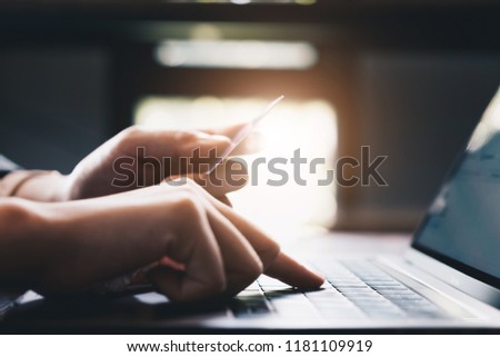 Online payment,Man's hands holding smartphone and using credit card for online shopping. Cyber Monday Concept