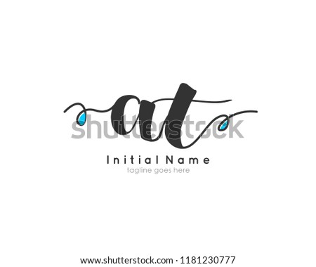 A T Initial handwriting logo vector template