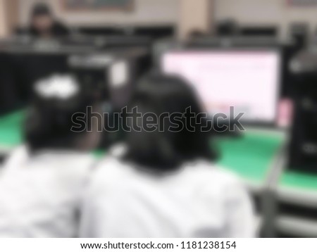 Blurred primary school classroom in Thailand. Blurred male or female students, teachers and team.