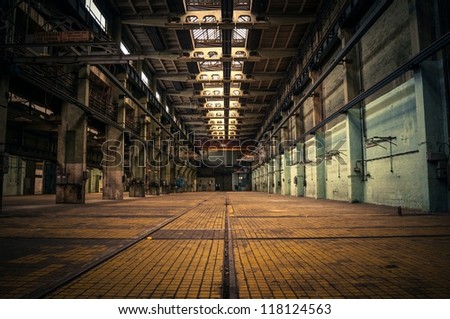 An abandoned industrial interior in dark colors Royalty-Free Stock Photo #118124563