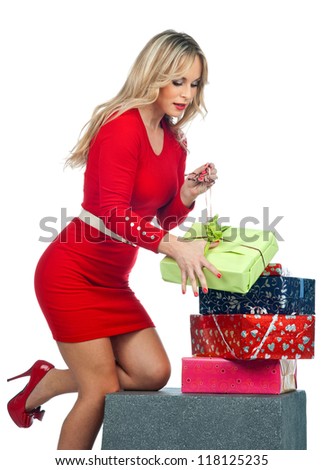 attractive woman in red holding lot of gifts