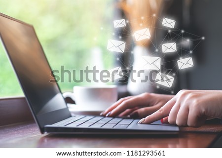 Businesswoman using laptop to send e-mail. Social media concept Royalty-Free Stock Photo #1181293561