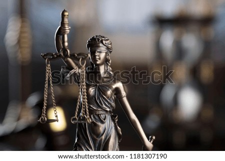 Law concept. Old library, scales, statue of justice, clock, hourglass. Bokeh background. Place for typography.