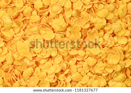 Corn-flakes background and texture. Top view. cornflake cereal box for morning breakfast. Royalty-Free Stock Photo #1181327677