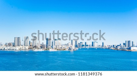 Asia Business concept for real estate and corporate construction - panoramic city skyline aerial view of tokyo bay with mirror reflection under blue sky in odaiba, Tokyo, Japan