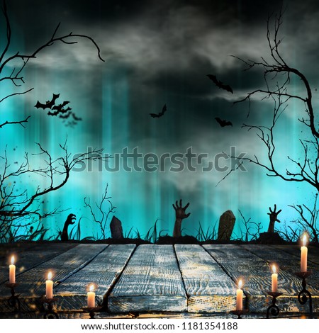 Spooky Halloween background with old trees silhouettes and flying bats.