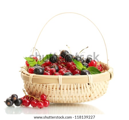 ripe berries with mint in basket isolated on white
