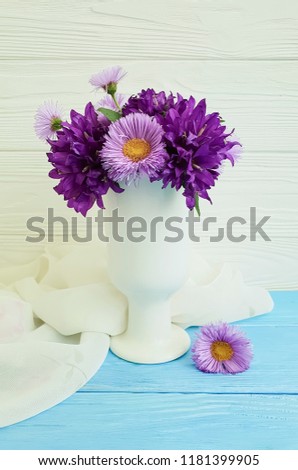 bouquet chrysanthemum bell in a vase on a wooden background