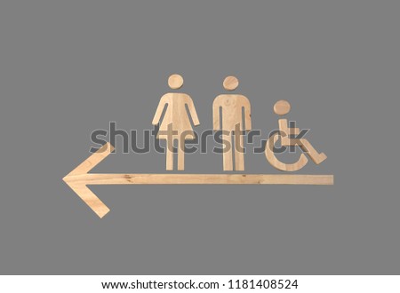 wooden arrow point to public toilet on wall,restroom sign
