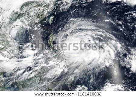 Super Typhoon Mangkhut (known locally as Ompong) Bearing Down on The Philippines. Elements of this image furnished by NASA Royalty-Free Stock Photo #1181410036