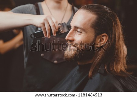 Process of cutting hair, hairdresser for men barber shop. Royalty-Free Stock Photo #1181464513