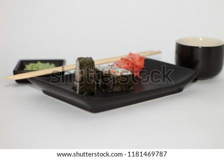  isolated sushi on a plate with wasabi and soy sauce