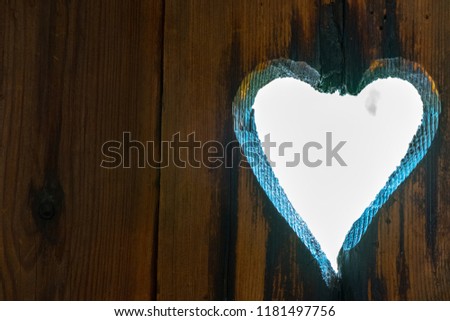 Heart shaped hole in vintage wood wall