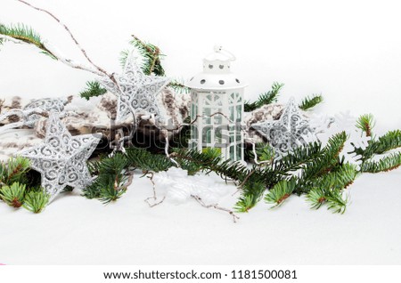 winter composition white decorative lantern and gray stars with sprigs of Christmas trees on white background