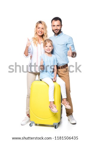 family with yellow suitcases showing thumbs up isolated on white