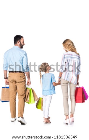 back view of family with shopping bags isolated on white