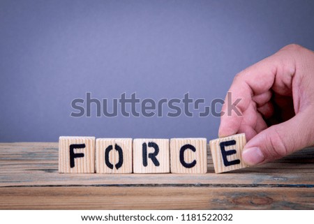 force. Wooden letters on the office desk, informative and communication background