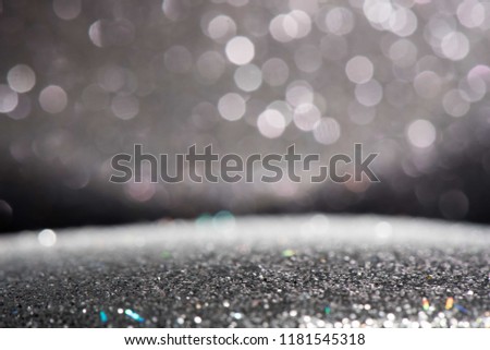 silver and black glitter background.