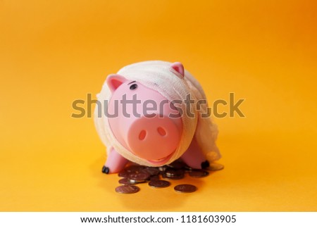poor injured piggy bank toy Royalty-Free Stock Photo #1181603905