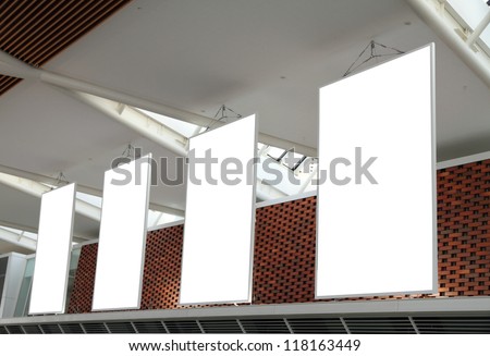 Blank billboard hanging from airport ceiling