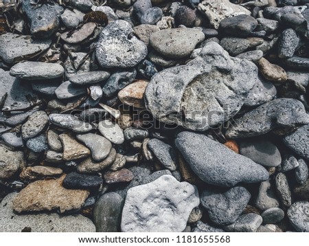 Pebbles Gray texture. Rough structure mineral. Rock texture. Background of sea stone. Gravel texture.  Abstract texture and background for designers