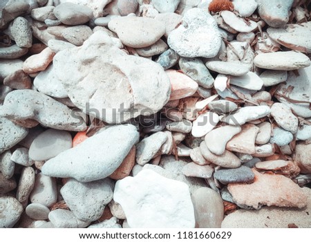 Pebbles white texture. Rough structure mineral. Rock texture. Background of sea stone. Gravel texture.  Abstract texture and background for designers