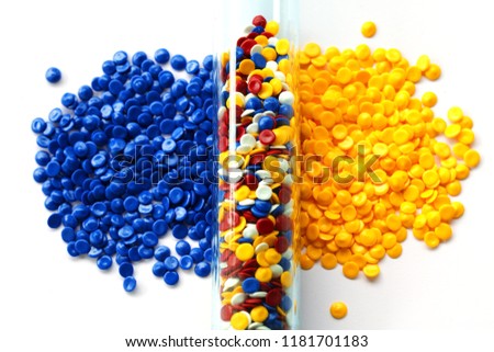 colorful industrial plastic pellet in test tube background
