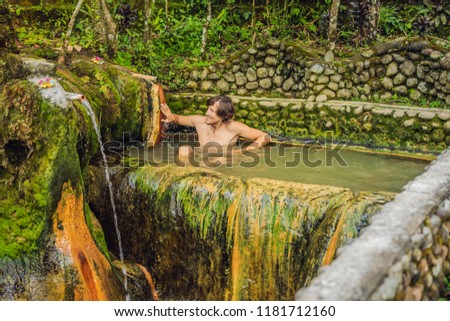 Man tourist in Belulang Hot Springs in Bali, Village Mengesta, Penebel District, Tabanan regency