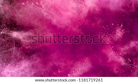 Explosion of coloured powder isolated on black background. Abstract colored background Royalty-Free Stock Photo #1181719261