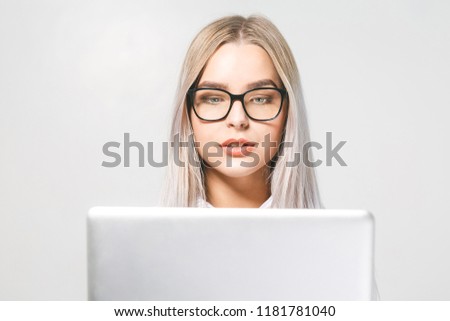 Portrait of happy wow young beautiful smiling woman standing with laptop isolated on white background. Space for text.