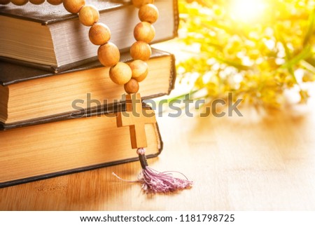 the wooden cross hang on stack of