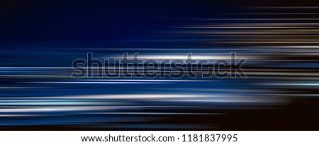 Abstract colorful light trails in the dark background