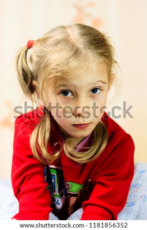 young girl with white hair lies on the bed. there is vignetting. close-up.