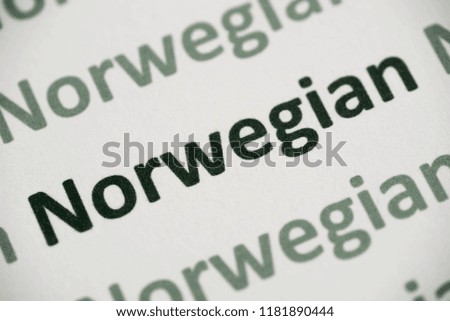 word Norwegian language printed on white paper macro