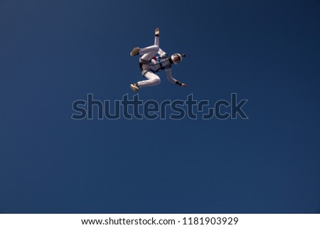 Woman skydiver in the sky