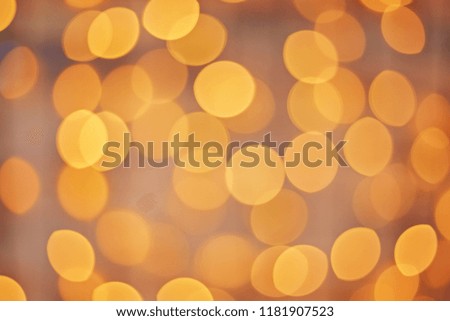 Golden beautiful blurred bokeh background with copy space. Holiday texture.