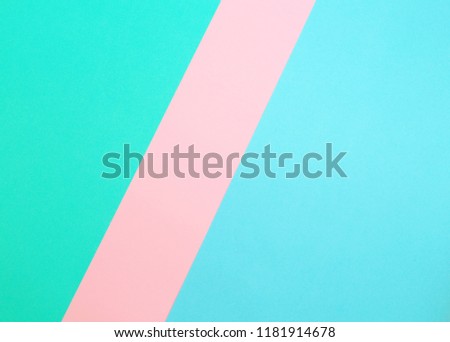 Blue, pink and light green color bands. Paper background. Image with space for text.