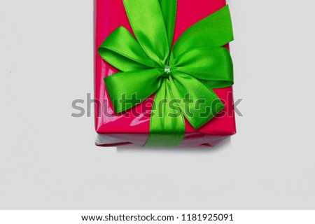 pink gift box tied with green broom