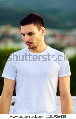 Picture of a handsome young man on the terrace. Outdoor