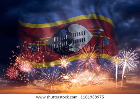 Holiday sky with fireworks and flag of Swaziland, independence day