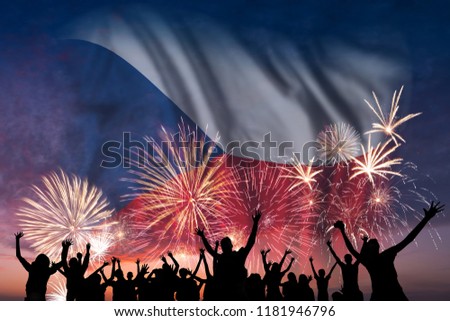 Happy people are looking holiday fireworks with flag of Czech Republic in sky, independence day