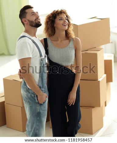 married couple standing in new apartment