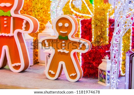 Street Christmas decoration, a huge figure of a Gingerbread man with garlands.